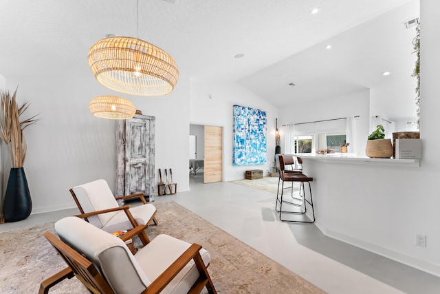 living room featuring lofted ceiling and an inviting chandelier