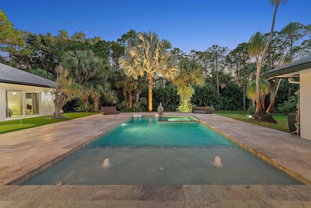 view of swimming pool featuring a patio area and an in ground hot tub