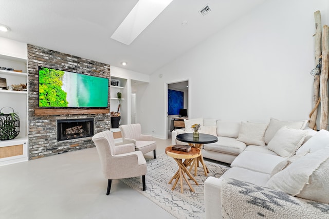 living room featuring high vaulted ceiling, a fireplace, a skylight, and built in features