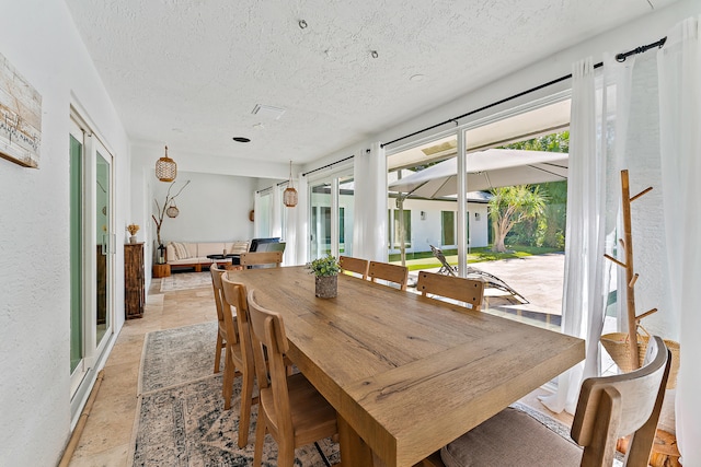 dining room with a textured ceiling