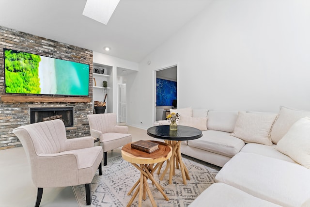 living room with a skylight, a brick fireplace, high vaulted ceiling, and built in shelves