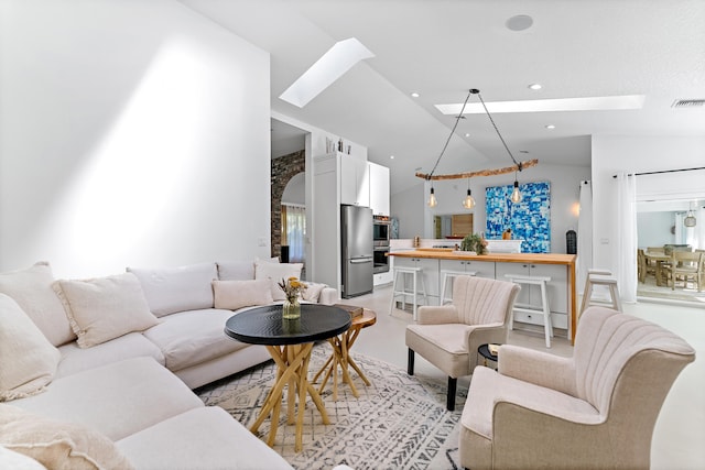 living room featuring vaulted ceiling