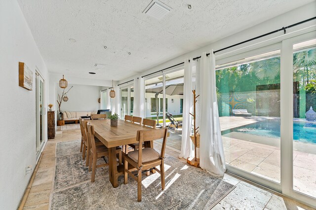 bedroom featuring ceiling fan, access to outside, and high vaulted ceiling