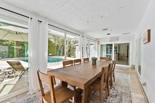 dining room with a textured ceiling