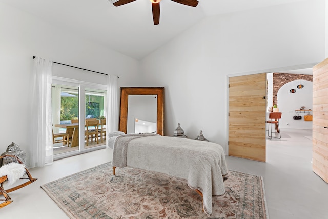 bedroom featuring concrete flooring, access to outside, high vaulted ceiling, and ceiling fan