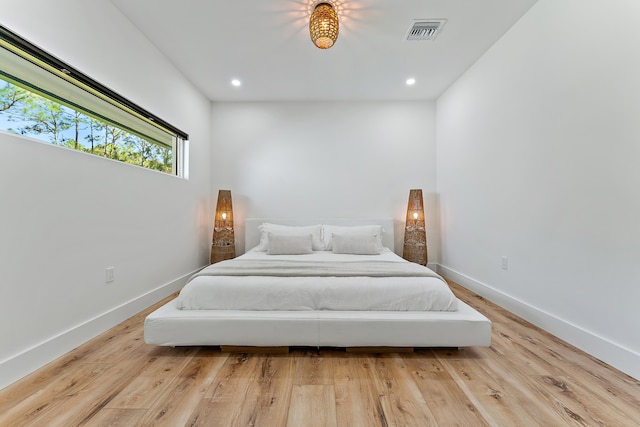 bedroom with light wood-type flooring