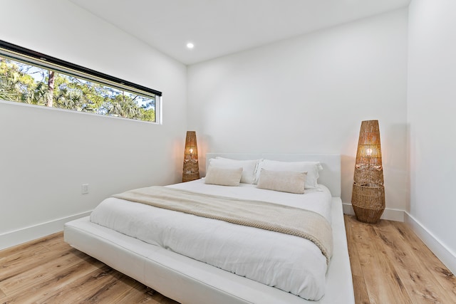 bedroom with hardwood / wood-style flooring