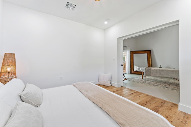 bedroom with hardwood / wood-style floors