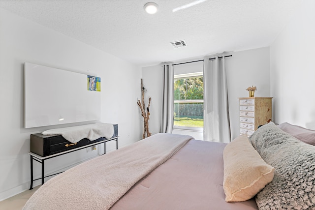 bedroom with a textured ceiling