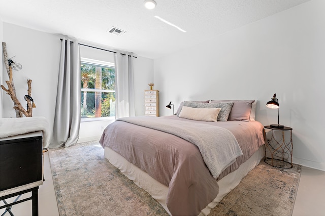 bedroom featuring a textured ceiling