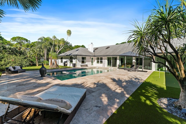 view of pool featuring a patio