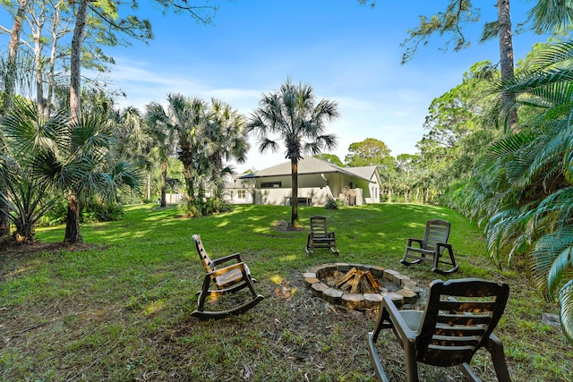 view of yard featuring a fire pit