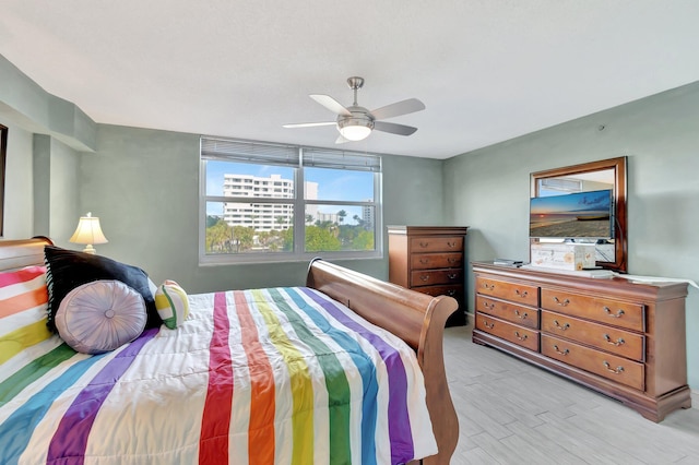 bedroom featuring ceiling fan and light hardwood / wood-style floors