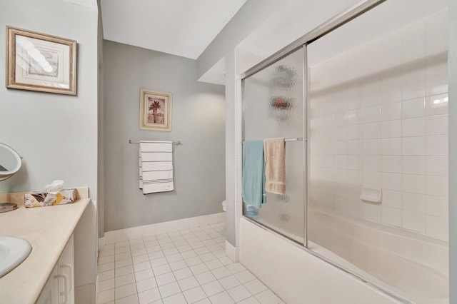 full bathroom featuring tile patterned flooring, vanity, toilet, and bath / shower combo with glass door