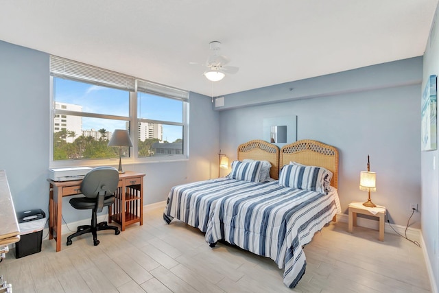 bedroom with light wood-type flooring and ceiling fan