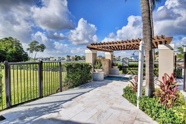 view of patio / terrace featuring a pergola and a swimming pool