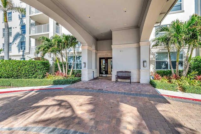 view of exterior entry featuring french doors