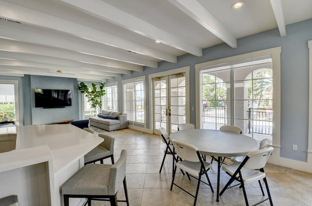 dining area with beamed ceiling and french doors