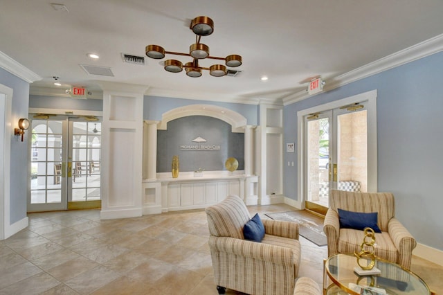 interior space with french doors, crown molding, and a notable chandelier