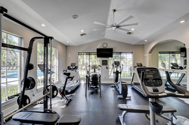 workout area featuring ceiling fan, plenty of natural light, and lofted ceiling