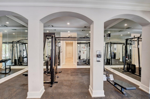 workout area featuring carpet and ornamental molding