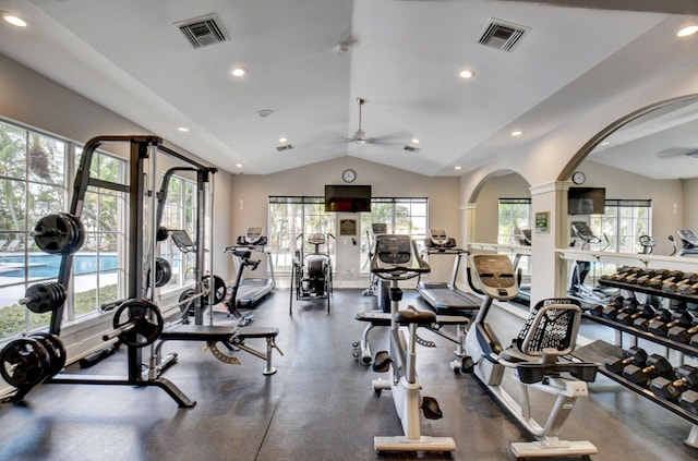 exercise room featuring ceiling fan, lofted ceiling, and decorative columns