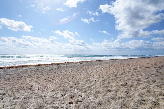 view of water feature with a beach view