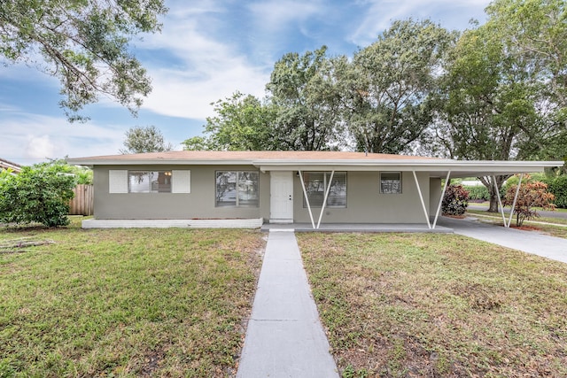 single story home featuring a carport and a front lawn