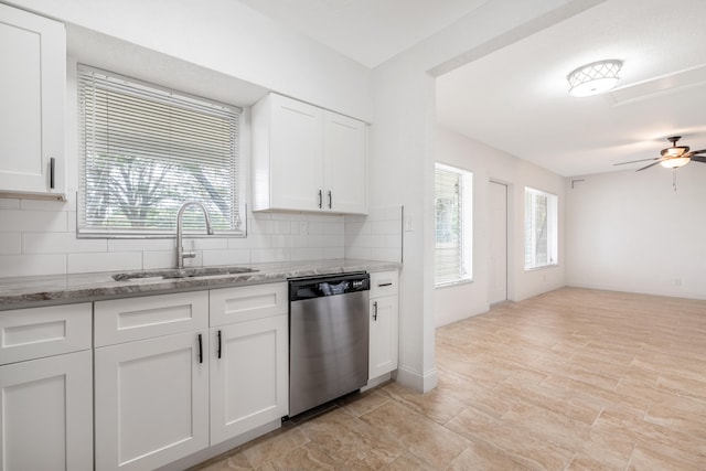 kitchen featuring dishwasher, white cabinetry, and a wealth of natural light