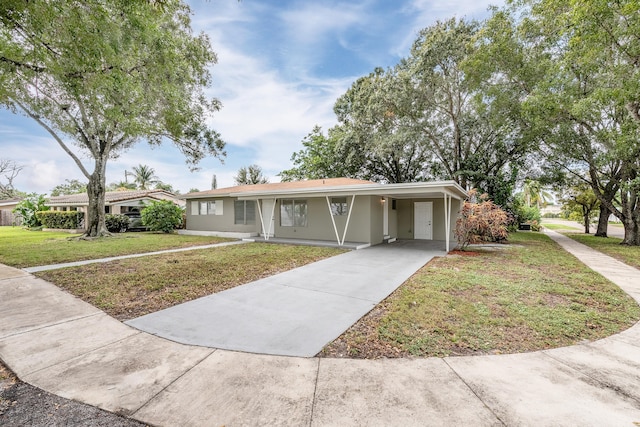 single story home with a carport and a front yard