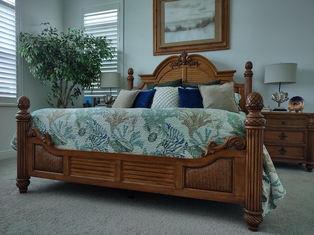 bedroom with light colored carpet