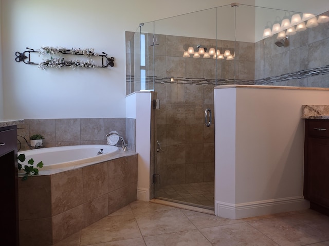 bathroom with tile patterned floors, vanity, and independent shower and bath