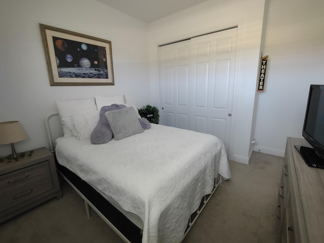 carpeted bedroom featuring a closet