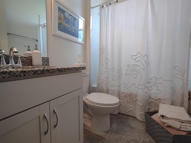 full bathroom with tile patterned floors, vanity, toilet, and shower / bathtub combination with curtain