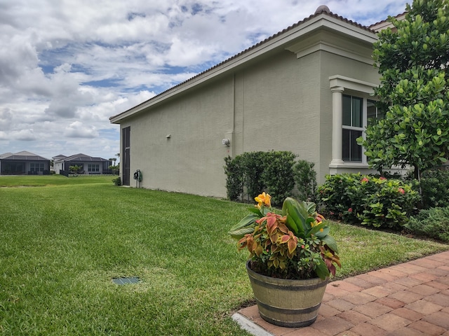 view of home's exterior with a lawn