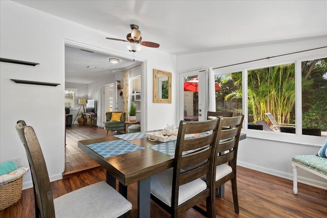 dining area featuring dark wood-type flooring, a wealth of natural light, and french doors