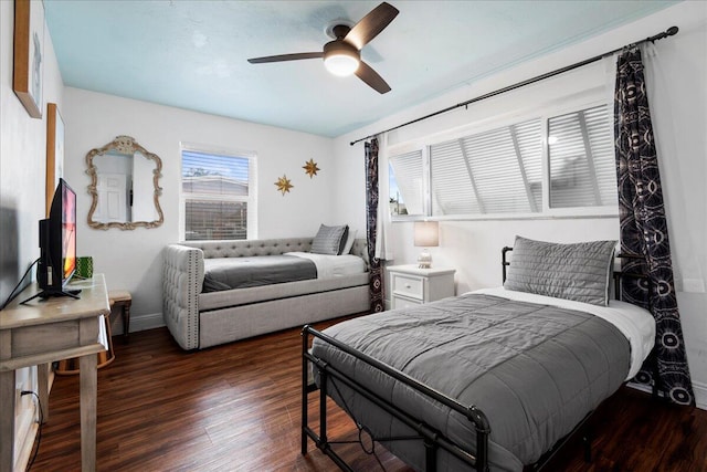 bedroom featuring dark hardwood / wood-style flooring and ceiling fan