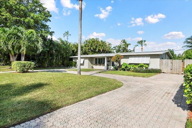 single story home with a front yard