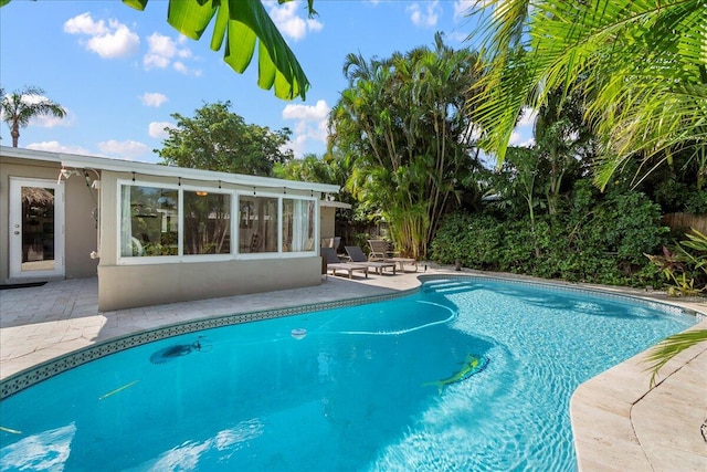 view of swimming pool with a patio area