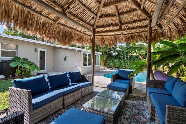 view of patio with outdoor lounge area and a gazebo