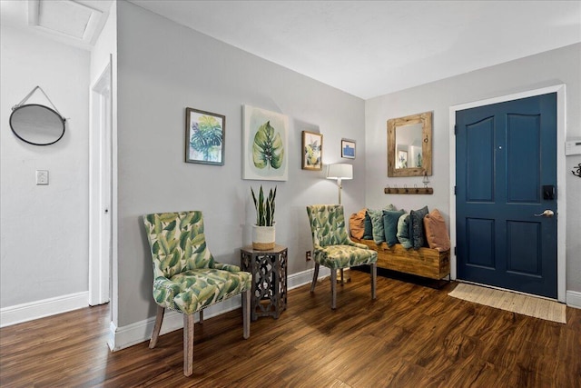 sitting room with dark hardwood / wood-style flooring