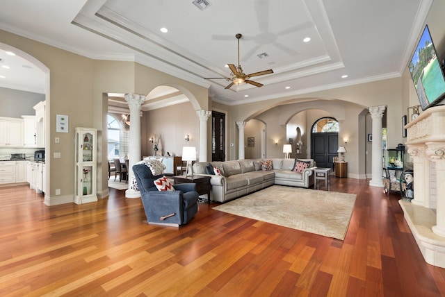 living room featuring ornamental molding and hardwood / wood-style flooring