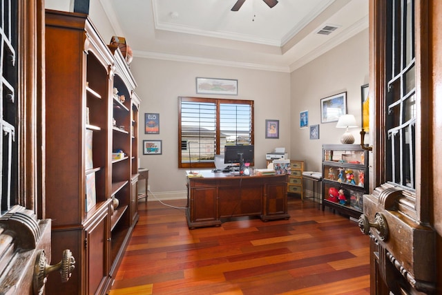 office with ornamental molding, a raised ceiling, ceiling fan, and dark wood-type flooring