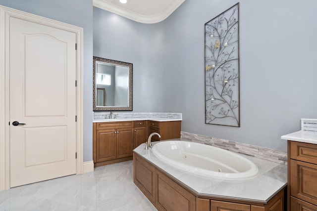 bathroom with vanity, a bath, and ornamental molding