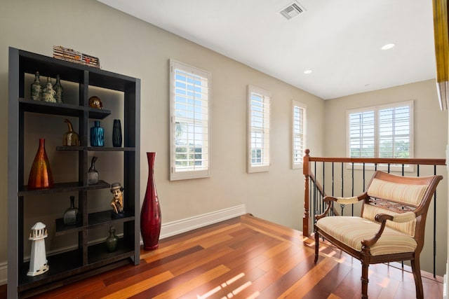 living area featuring hardwood / wood-style floors