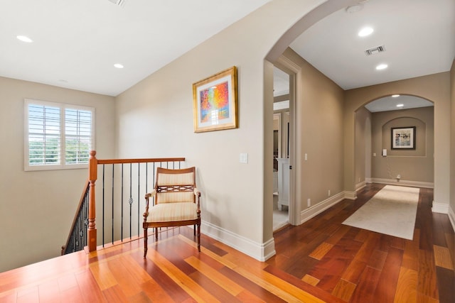 corridor featuring dark hardwood / wood-style flooring