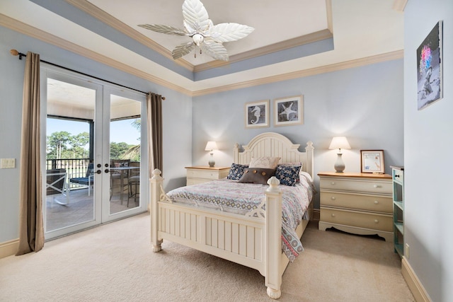 carpeted bedroom with access to outside, french doors, a raised ceiling, ceiling fan, and ornamental molding