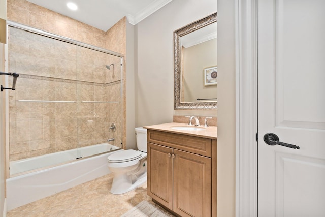 full bathroom with tiled shower / bath, tile patterned floors, toilet, vanity, and ornamental molding