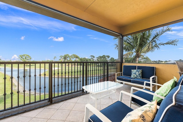 balcony featuring an outdoor hangout area and a water view