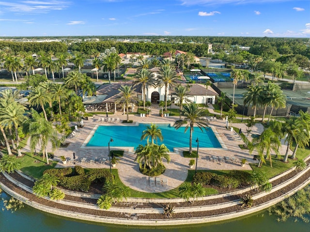 view of swimming pool featuring a water view